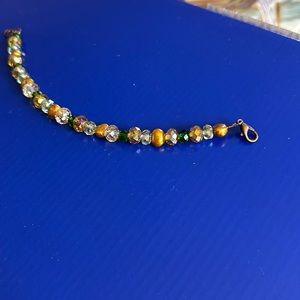 Green and gold beaded bracelet